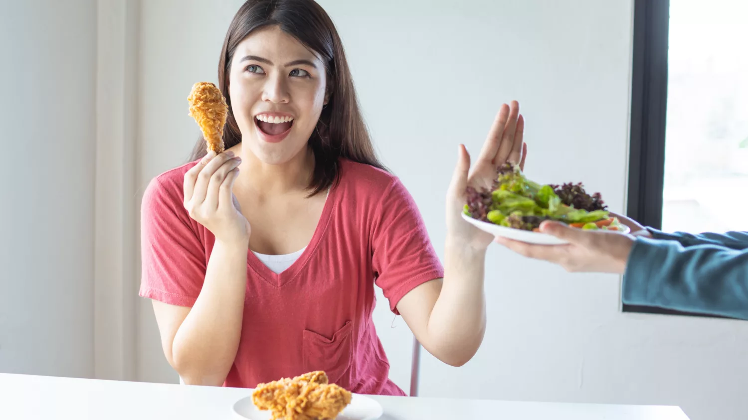 Woman refuses a salad instead of fried chicken full of trans fats