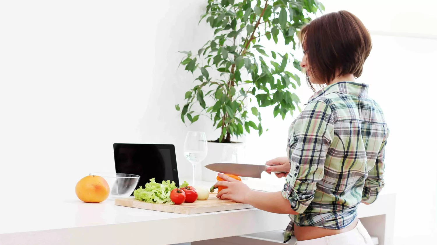 Woman preparing ingredients for a healthy vegetable dish